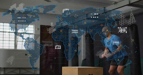 Athlete performing plyometric box jump in industrial gym with global data overlay