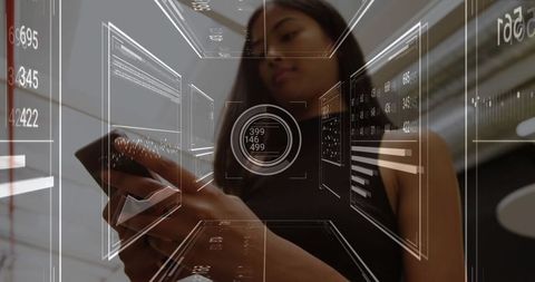 Woman Interacting with Holographic Data Interface in Modern Setting