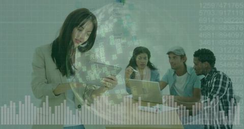 Collaborating team analyzing digital data overlay with woman tapping tablet, business tech