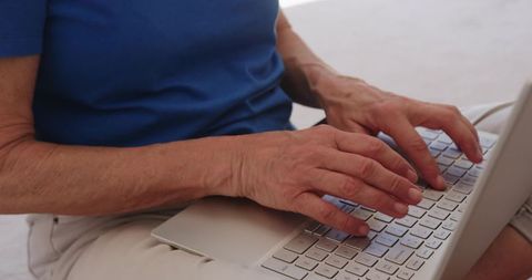 Elderly Woman Using Laptop at Home Leisurely