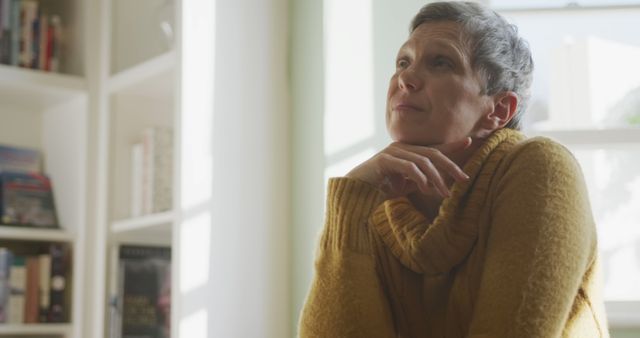 Thoughtful Woman in Cozy Sweater Sitting in Bright Living Room - Download Free Stock Images Pikwizard.com