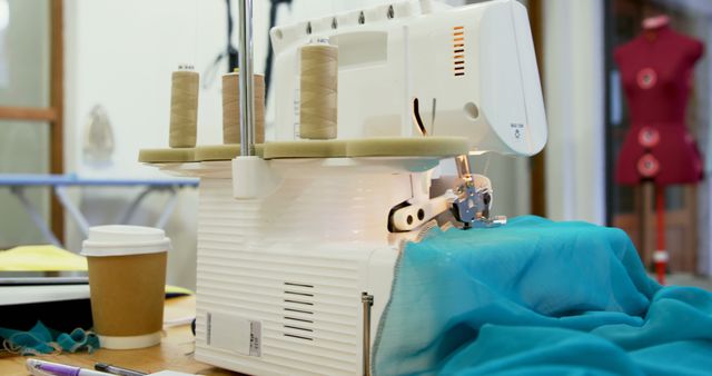 Sewing Machine Working on Blue Fabric in Tailor Shop - Download Free Stock Images Pikwizard.com