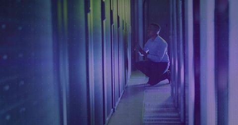 Technician Managing Servers in Futuristic Data Center