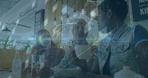 Diverse team collaborating over coffee in modern cafe with digital data overlay for startup