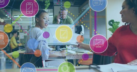 Diverse team collaborating in modern office with digital interface overlay
