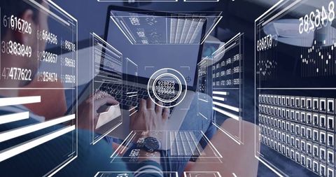 Typing Developer Analyzing Futuristic HUD Dashboard and Analytics Overlays on Laptop
