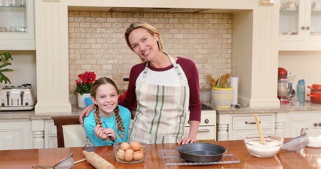 Mother and Daughter Smiling in Kitchen Preparing Dough - Download Free Stock Images Pikwizard.com