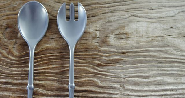 Close-up of Spoon and Spork on Wooden Surface - Download Free Stock Images Pikwizard.com