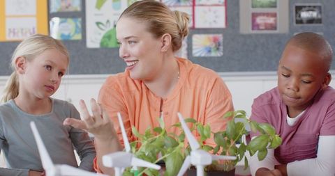 Dedicated Teacher Explaining Renewable Energy via Wind Turbines