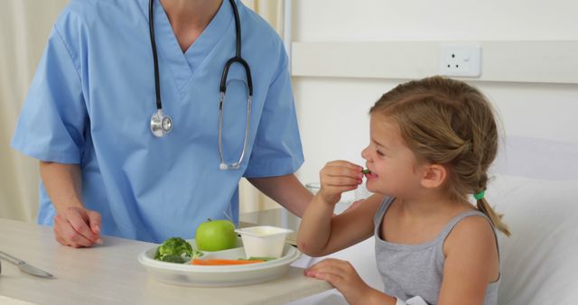 Nurse Caring for Child with Healthy Meal in Hospital - Download Free Stock Images Pikwizard.com