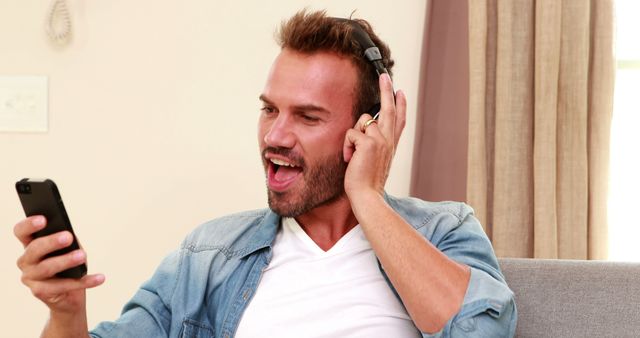 Handsome man listening to music - Download Free Stock Photos Pikwizard.com