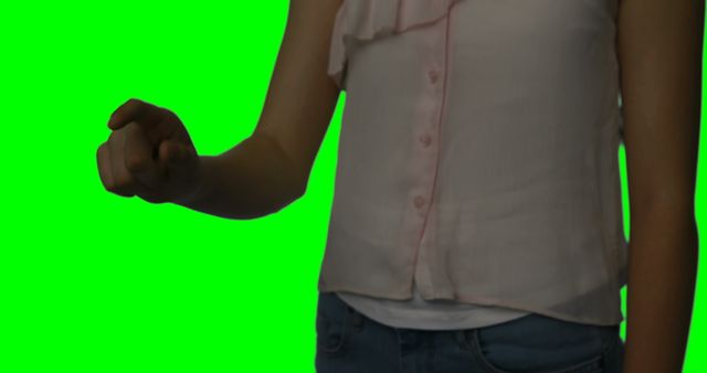 Person Gesturing with Closed Fist on Green Background - Download Free Stock Images Pikwizard.com