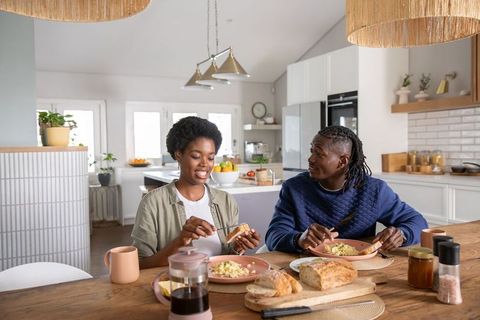 African american couple enjoying breakfast together at home