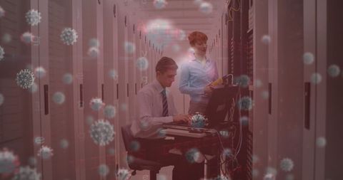 Virus Cells Overlay on Professionals in Server Room Working with Technology - Download Free Stock Images Pikwizard.com