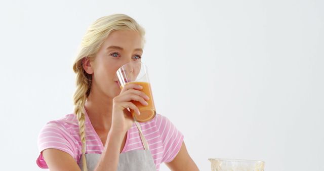 Young Woman Drinking Homemade Smoothie in Bright Kitchen - Download Free Stock Images Pikwizard.com