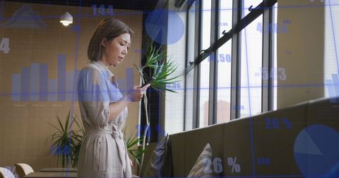 Businesswoman Analyzing Data on Smartphone with Growing Graphs - Download Free Stock Images Pikwizard.com
