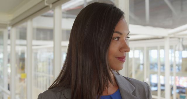 Confident Businesswoman Posing in Modern Office Environment - Download Free Stock Images Pikwizard.com