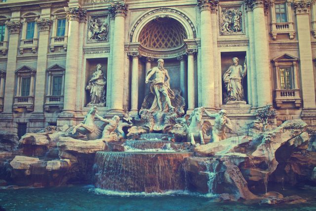 Trevi Fountain, iconic Roman landmark, features ornate sculptures and cascading water. Ideal for travel blogs, architecture studies, historical documentaries, or tourism promotions showcasing the beauty and heritage of Rome.