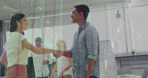 Business Partners Sealing Deal Over Business Analytics Visualization