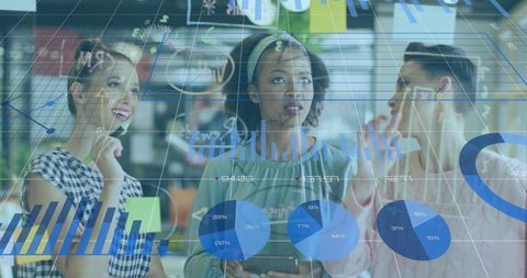 Team Collaborating on Data Visualization with Interactive Charts and Tablet in Coworking Space