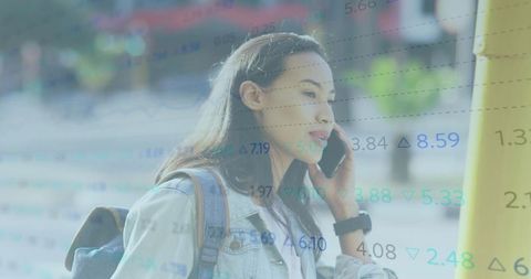 Asian Woman on Phone with Overlap of Stock Market Data Outdoors