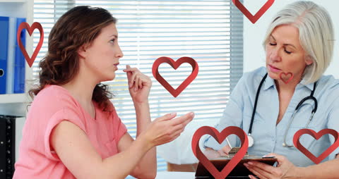 Female Doctor Consulting Patient with Heart Shapes Overlaid