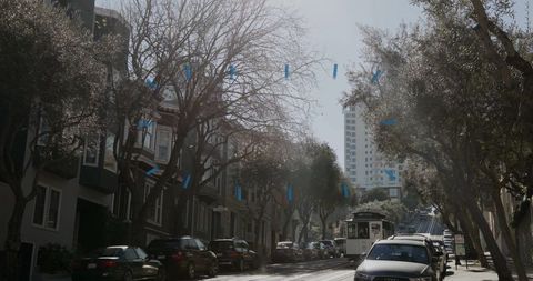 Historic vintage cable car traveling down san francisco street