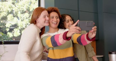 Diverse Friends Enjoying Selfie in Bright Modern Kitchen