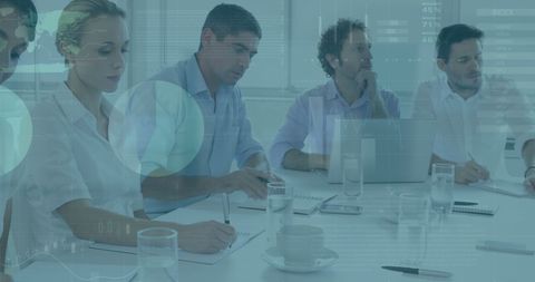 Financial Team Analyzing Data in Modern Office Meeting