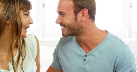 Happy Couple Laughing Together in Bright Living Room - Download Free Stock Images Pikwizard.com