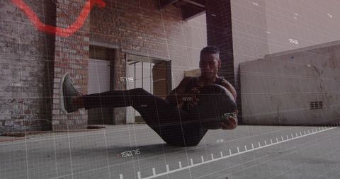 African american athlete training with kettlebell in industrial warehouse with hud overlay
