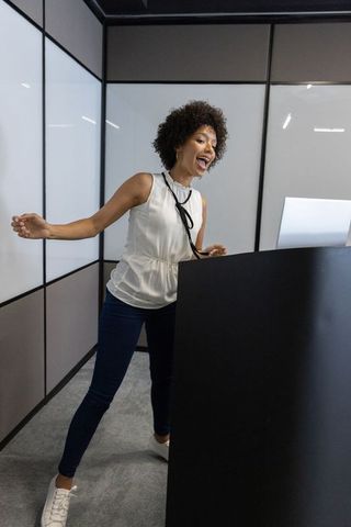 Woman enthusiastically hosting business presentation
