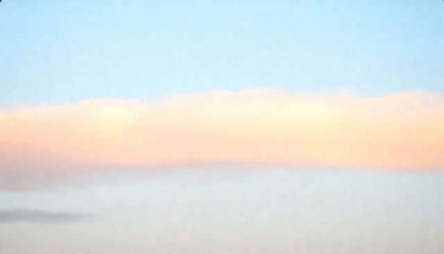 Pastel horizon with peach cloud band over soft blue sky minimalist gradient background