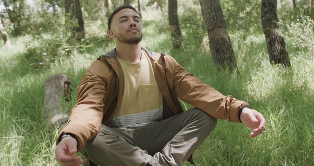 Young Man Meditating Outdoors in Woodland - Download Free Stock Images Pikwizard.com