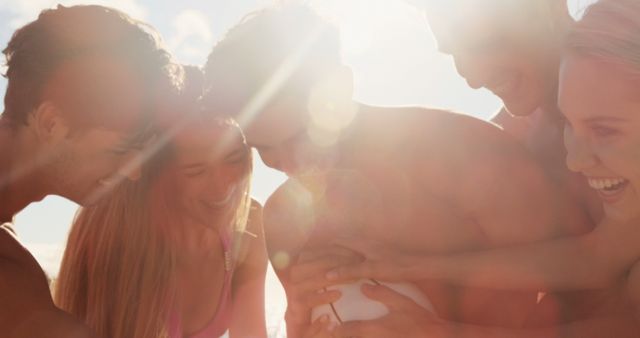 Group of Friends Enjoying a Sunlit Beach Gathering - Download Free Stock Images Pikwizard.com