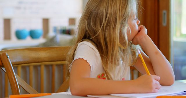 Young Girl Studying at Home Emphasizes Importance of Early Education - Download Free Stock Images Pikwizard.com