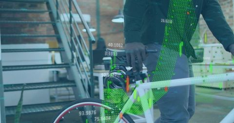 Professional holding bicycle in loft office with augmented green data charts and analytics