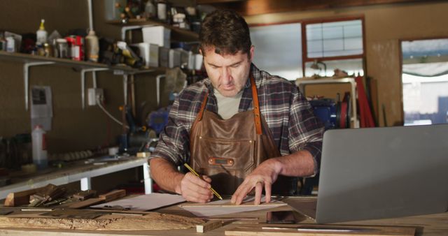 Male Carpenter Working on Design Project at Workbench in Workshop - Download Free Stock Images Pikwizard.com