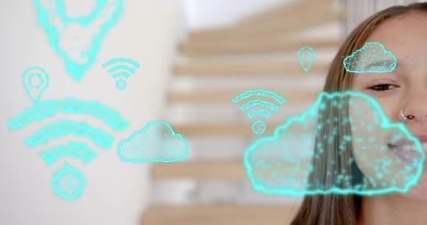 Teen with nose ring interacting with virtual cloud and wi-fi holograms in modern home