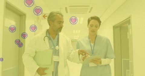 Healthcare Professionals Collaborate in Hospital Corridor