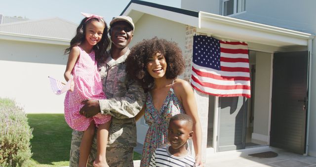 US veteran returning home embracing his family, highlighting emotions of joy and pride. American flag in background reinforces patriotism. Perfect for use in articles or campaigns about military families, homecoming celebrations, or stories highlighting the service and sacrifice of veterans. Can also be used in promotional materials for Veterans Day, Memorial Day, or Independence Day.