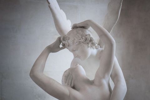 Romantic marble sculpture embracing lover's kiss