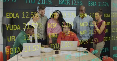 Diverse team analyzing stock data in contemporary meeting room