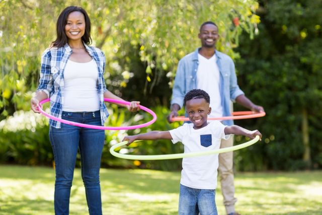 Happy family hooping together at park