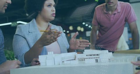 Diverse Architect Team Collaborating on Urban Design Project at Work Studio