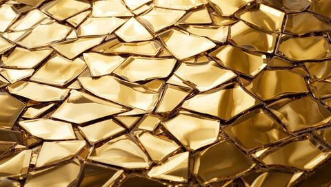 Gleaming Gold Mosaic Featuring Irregular Faceted Glass Shards Reflecting Warm Light