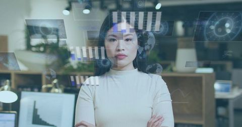 Chinese data analyst standing confident with holographic charts and analytics overlays in modern off