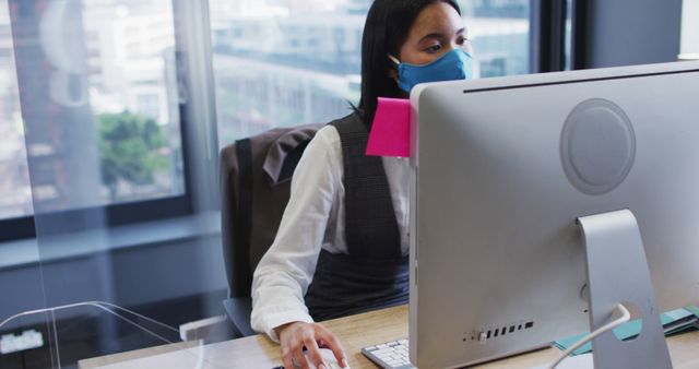 Professional Woman Working from Office Wearing Face Mask - Download Free Stock Images Pikwizard.com