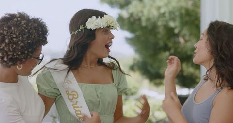 Bride Preparing for Wedding with Friends Outdoors Shared Excitement