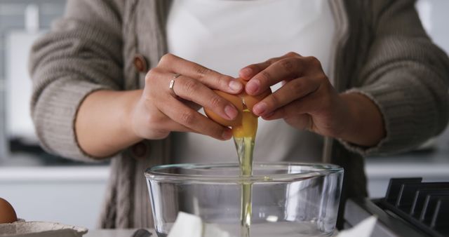 Close-Up of Person Cracking Egg into Glass Bowl - Download Free Stock Images Pikwizard.com